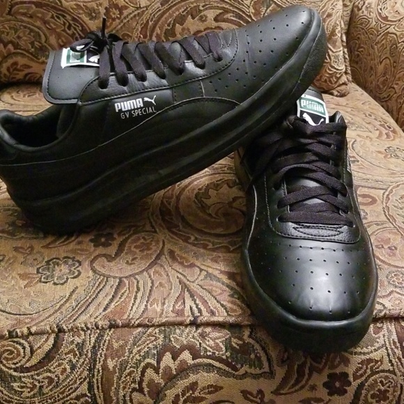 all black leather pumas